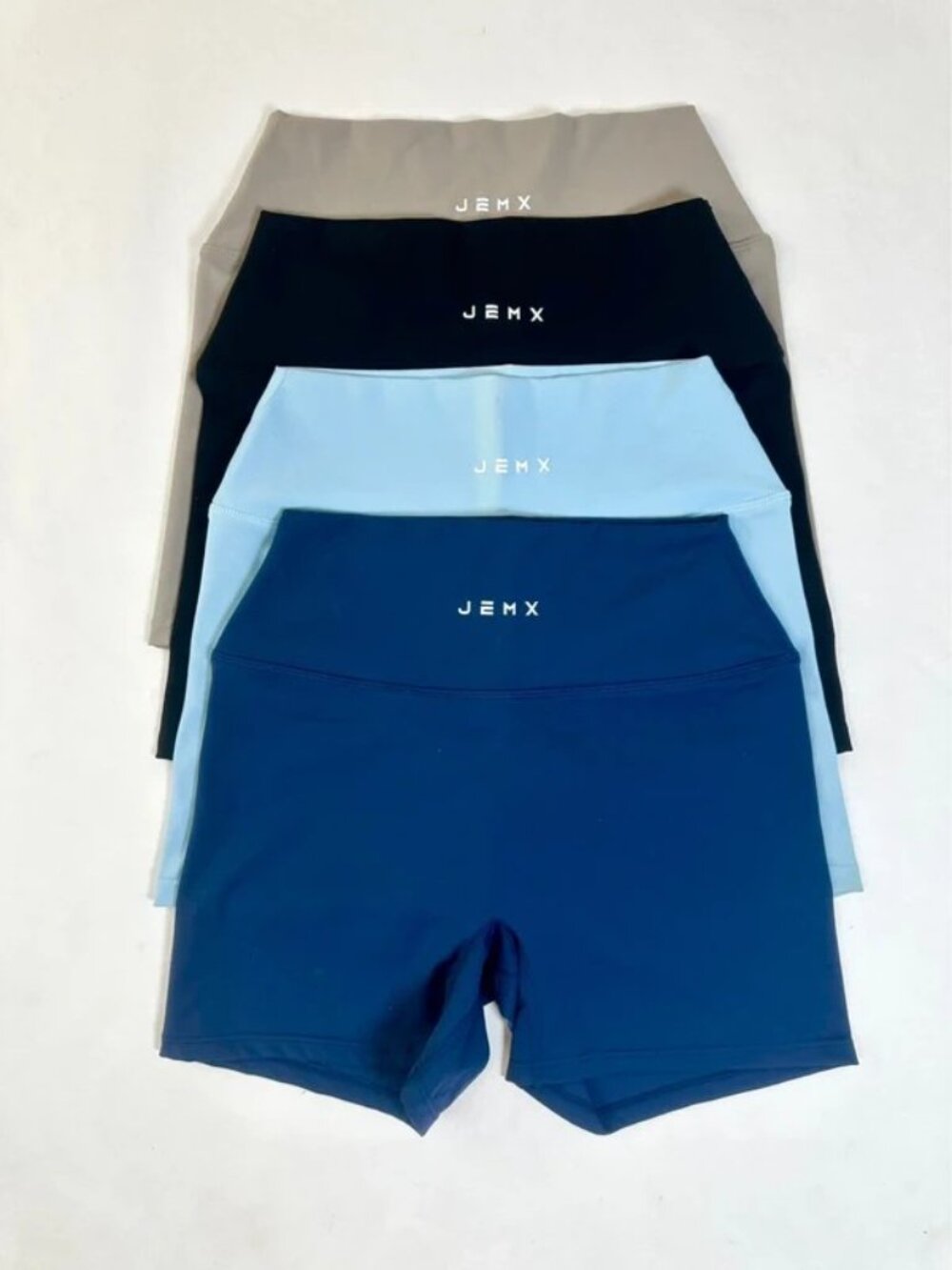4 pack gym shorts Navy, light blue, black and mocha brown. Jemx sportswear short